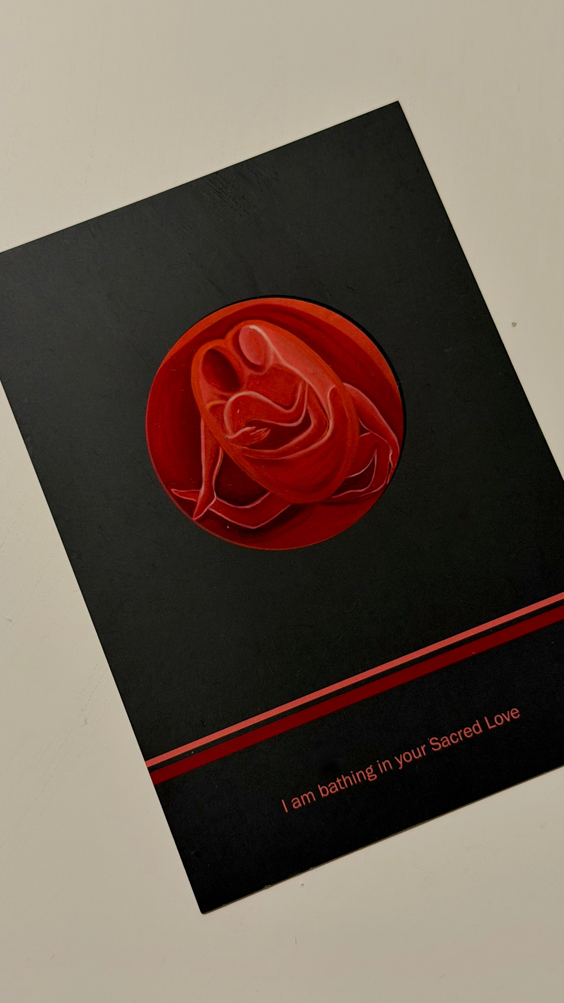Black postcard with a couple embracing design and text on a black background